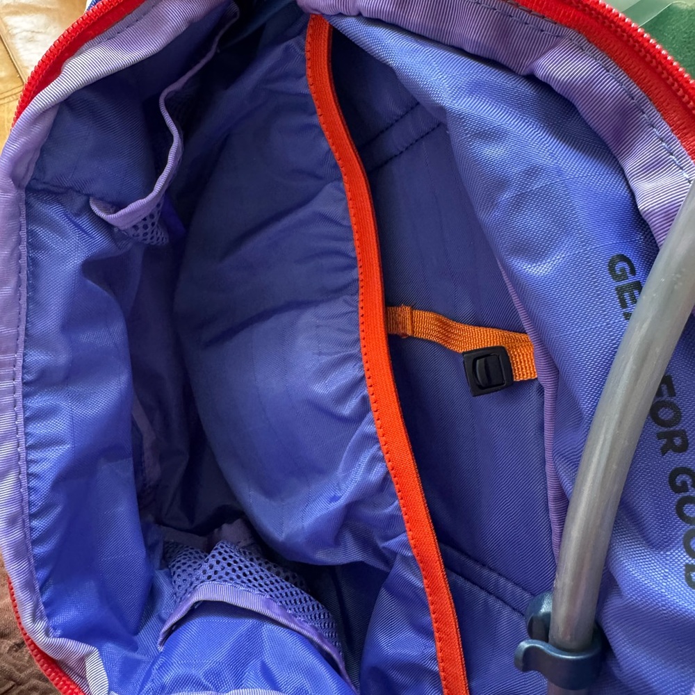 Cotopaxi 2L purple hydro hip pack with red and orange accents. - Picture 3 of 4